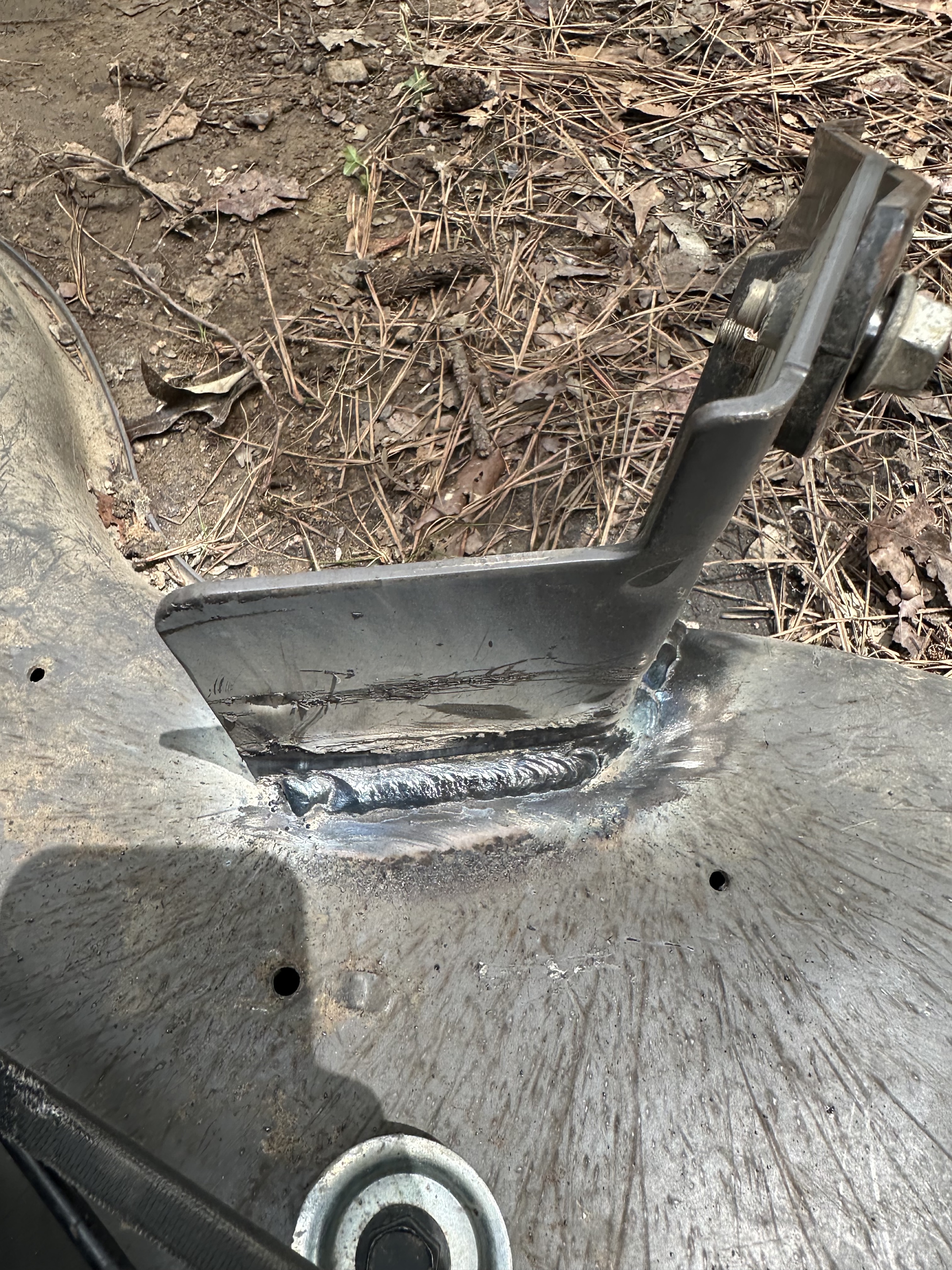 Close view of a reinforced steel equipment repair by K&G Welding