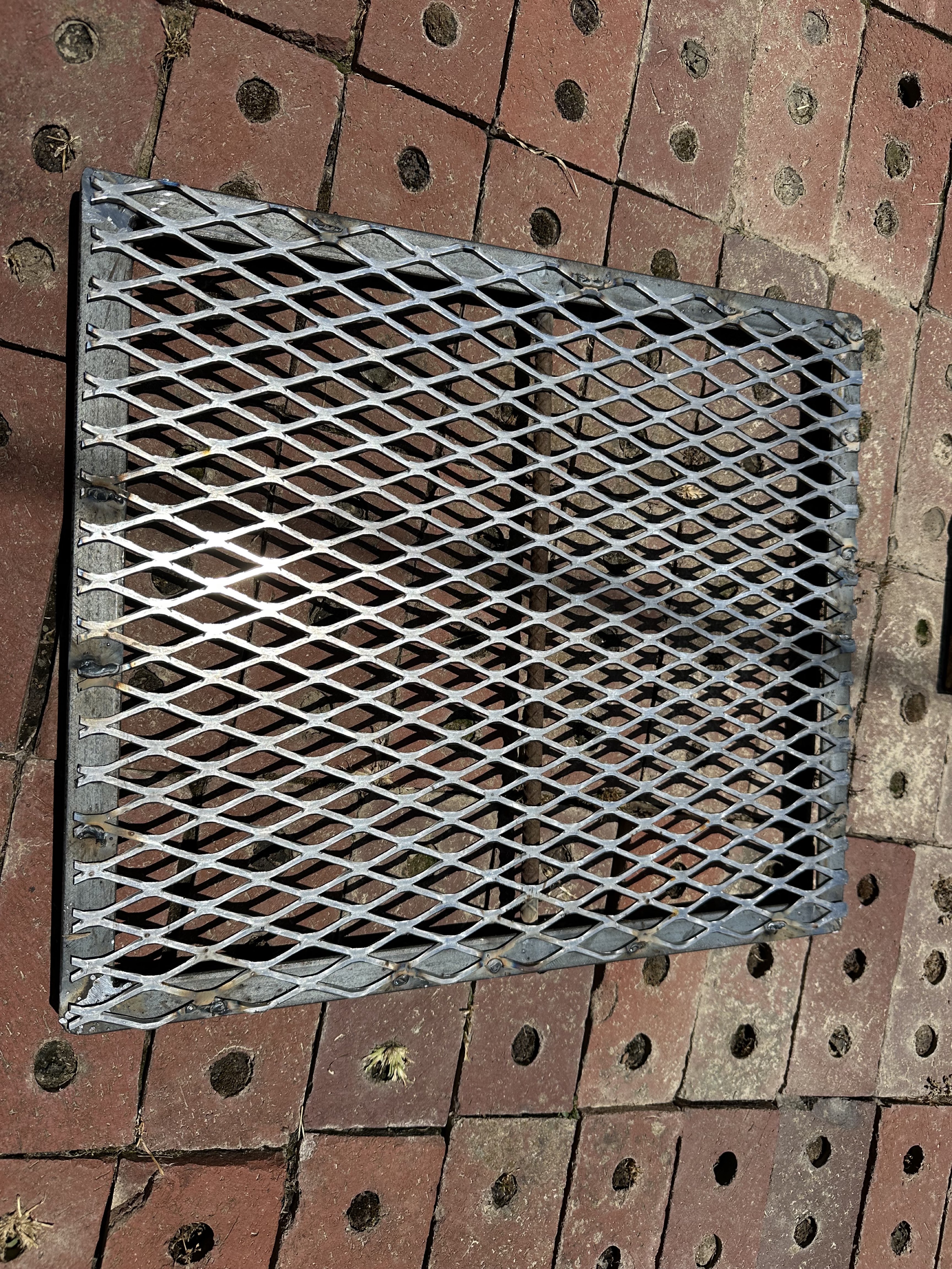 Newly fabricated expanded-metal grill grate after repair