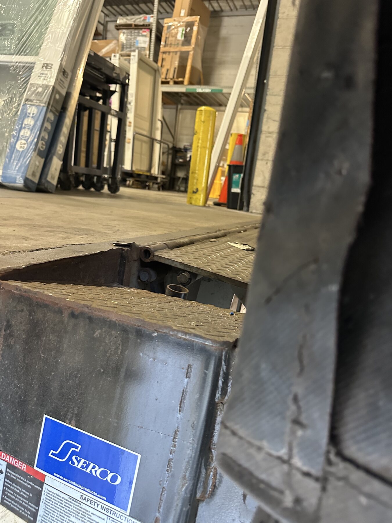 Loading dock plate steel connection before welding repair